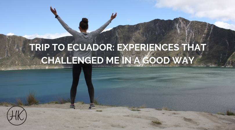 Girl standing at the edge of a crater lake in Ecuador