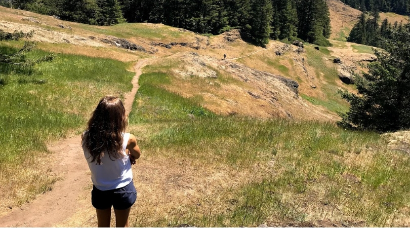 Women staring down a hiking trail